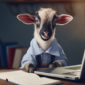 Cute goat dressed in business clothes sits with a laptop.